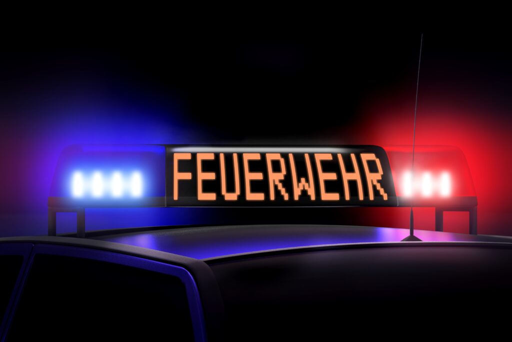 Firefigters red and blue lights Firefighters English Feuerwehr German